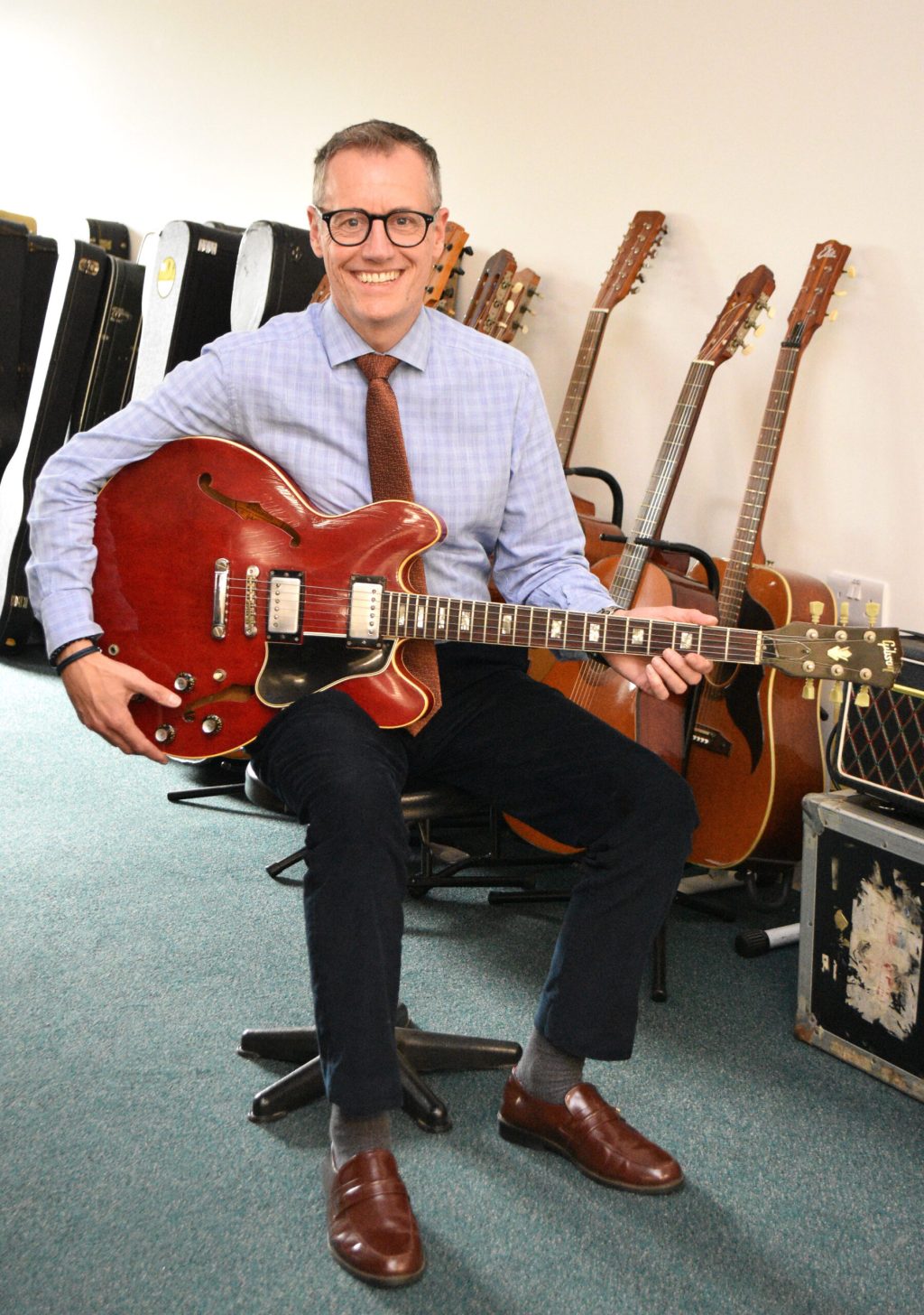 Alexander with guitars
