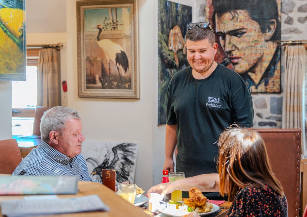 Aaron Jones with customers