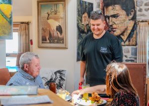 Aaron Jones with customers